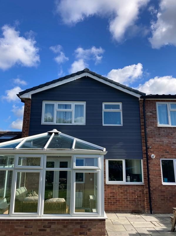 House with new grey cladding, fascias and guttering fitted by JDN Plastics